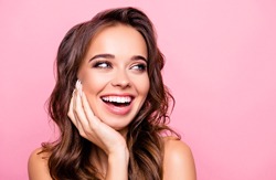 smiling woman with beautiful teeth against pink background