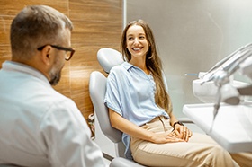 Man smiles at dentist