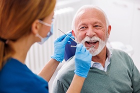 Dentist shows patient x-ray