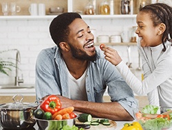 Happy man enjoying food thanks to dental crowns