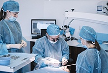 Marshall implant dentist performing dental implant surgery