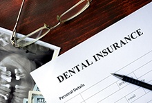 Dental insurance paperwork for the cost of dental implants in Marshall