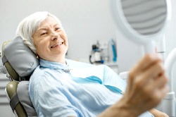 Woman smiling looking at her reflection