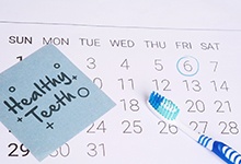 Dental appointment circled on calendar next to “healthy teeth” note