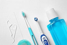 Oral hygiene tools, including floss, toothbrushes, and mouthwash