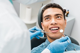 man wondering if it is cheaper to remove a tooth instead of root canal therapy
