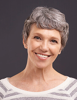 woman with grey hair smiling