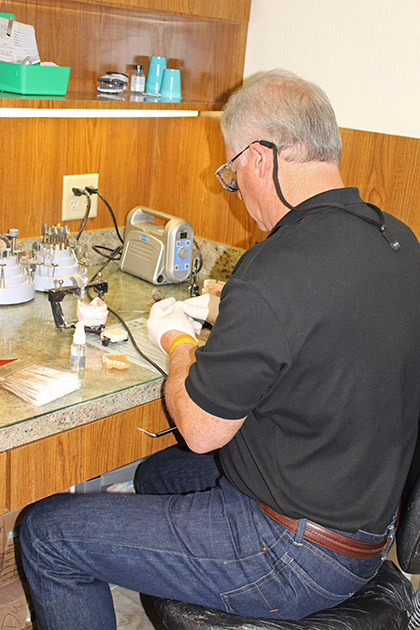 Dr. Parker working on dentures