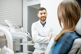 Cosmetic dentist in Marshall smiling while talking to patient
