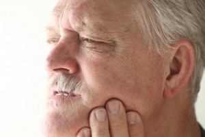 Dentist in 75670 discusses uncomfortable implant dentures. 