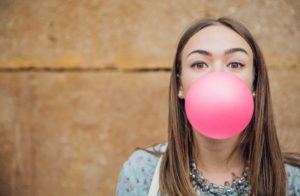 young woman chewing gum 