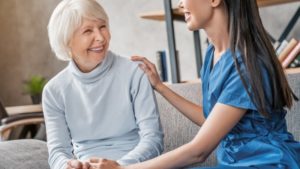 Smiling woman after visiting dentist for seniors in Marshall