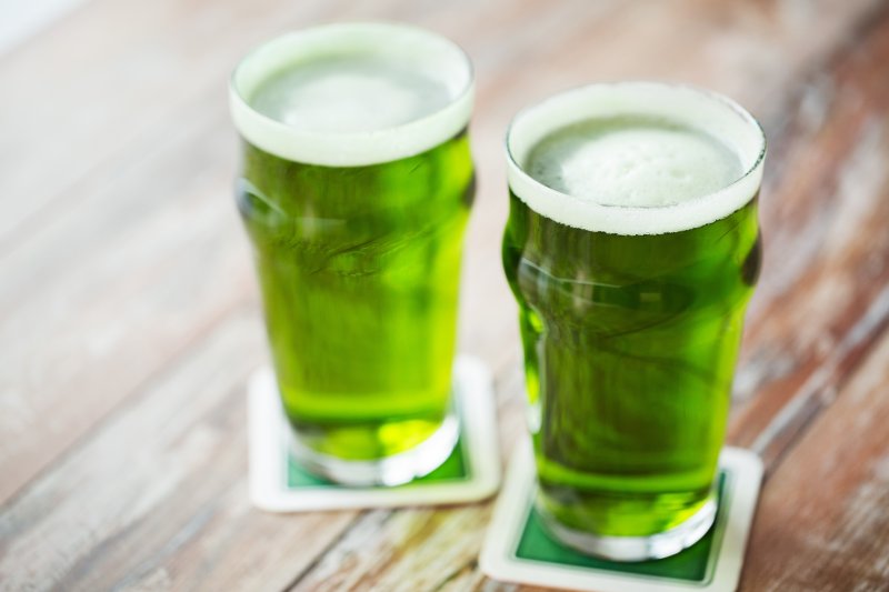 green beer sitting on a table 