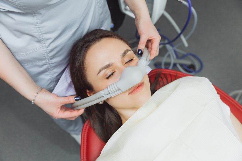 A woman getting dental sedation